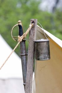 Close-up of rope tied on wooden post