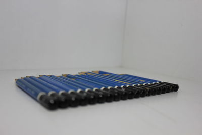 High angle view of piano on table against white background