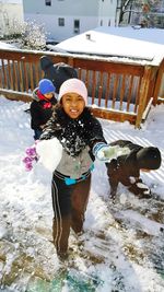 Portrait of smiling girl in snow