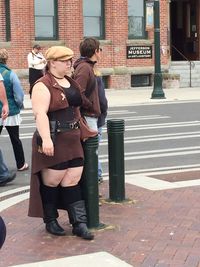 Woman standing on city street