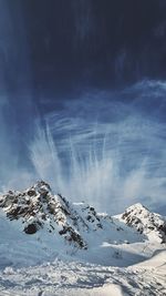 Scenic view of snowcapped mountain against sky