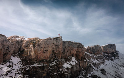 Rock formations on mountain against sky