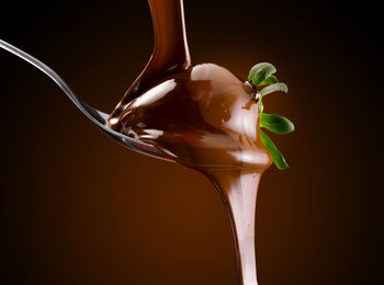 Close-up of ice cream over black background