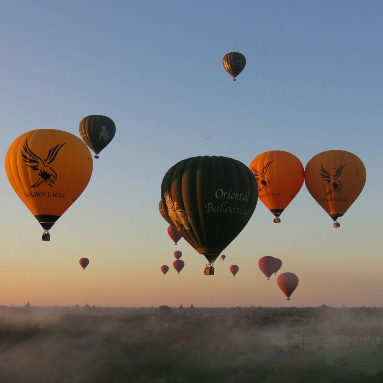 LOW ANGLE VIEW OF HOT AIR BALLOONS FLYING IN SKY