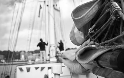 Close-up of canvas tied on mast over boat