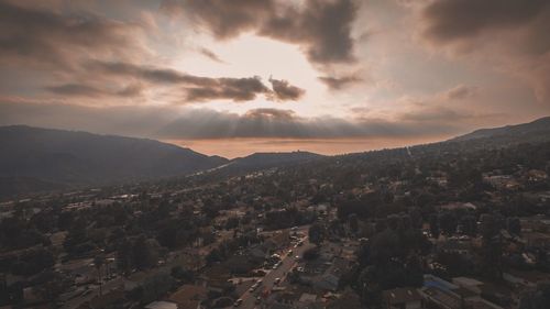 Scenic view of mountains against cloudy sky