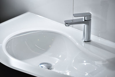 Chrome tap and white modern sink