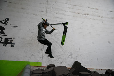 Man jumping on wall