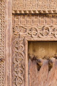 Low angle view of carvings on wall