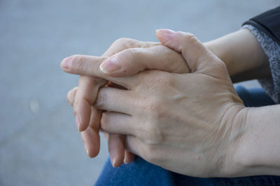 Close-up of couple holding hands