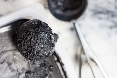 High angle view of black coffee in container