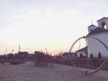 Scenic view of beach against sky during sunset