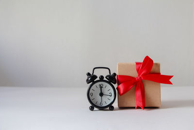 Close-up of alarm clock on table