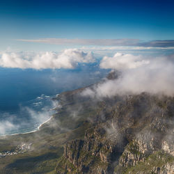 Aerial view of mountain range against sky