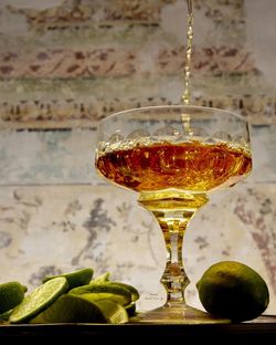 Close-up of drink with lemon slices on table