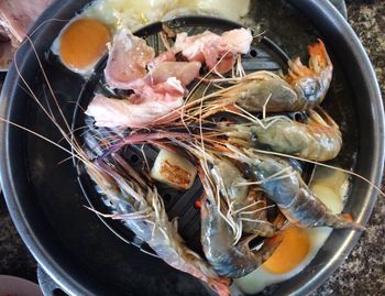 High angle view of meat in cooking pan