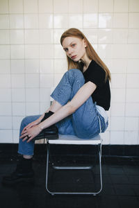 Woman with legs sitting on a chair