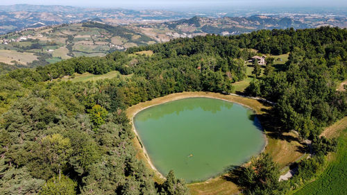 Aerial view from the drone of little lake on italian  hills