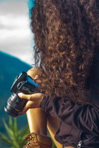 Portrait of woman photographing