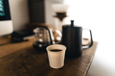 Close-up of coffee cup on table