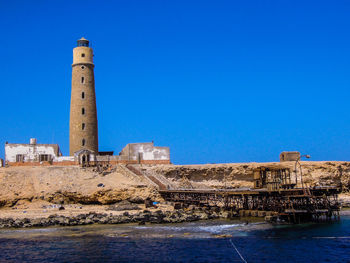 View of lighthouse against blue sky