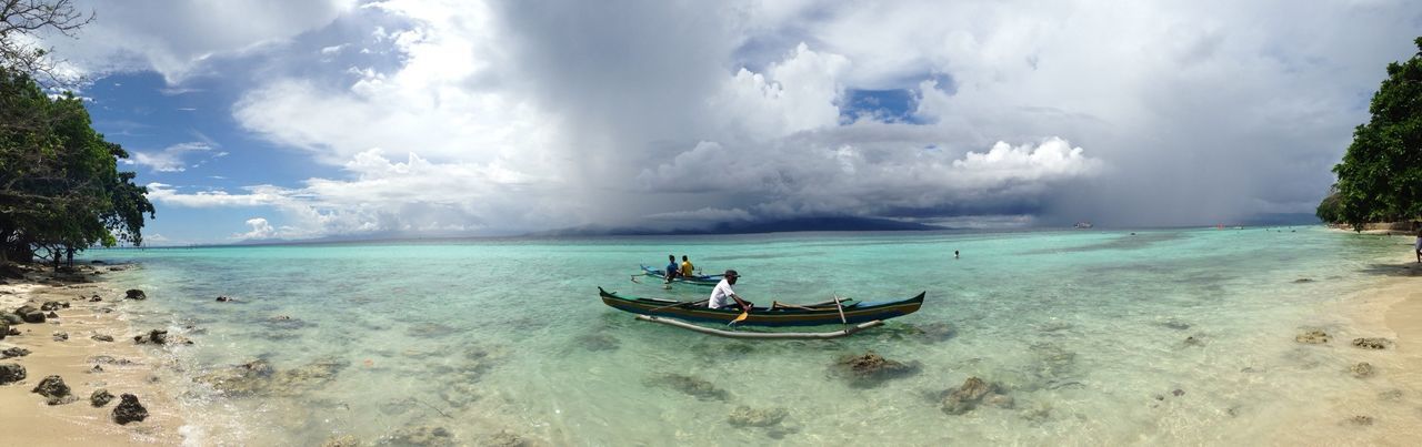 sea, beach, sky, water, sand, horizon over water, shore, cloud - sky, tranquility, scenics, tranquil scene, beauty in nature, nautical vessel, nature, cloudy, transportation, boat, vacations, cloud