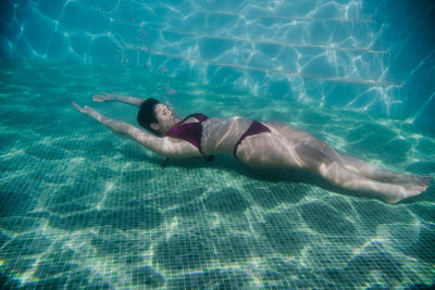 Man swimming in pool