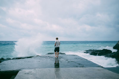 Scenic view of sea against cloudy sky