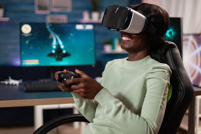 Smiling woman using virtual reality headset