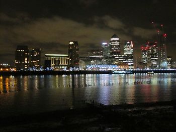 Illuminated city at waterfront