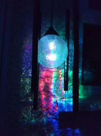 Electric lamp hanging on wall