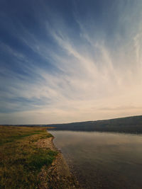 Scenic view to the riverbank of nistru river, moldova. vertical background, calm water 