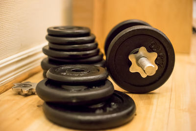 Close-up of barbell on hardwood floor