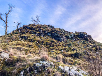 Low angle view of rocks against sky