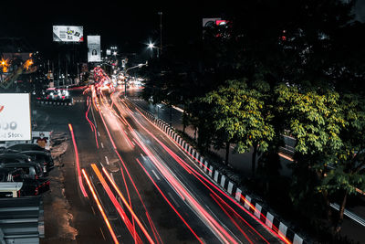 High angle view of light trails on city street at night