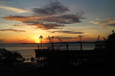 Scenic view of sea against orange sky