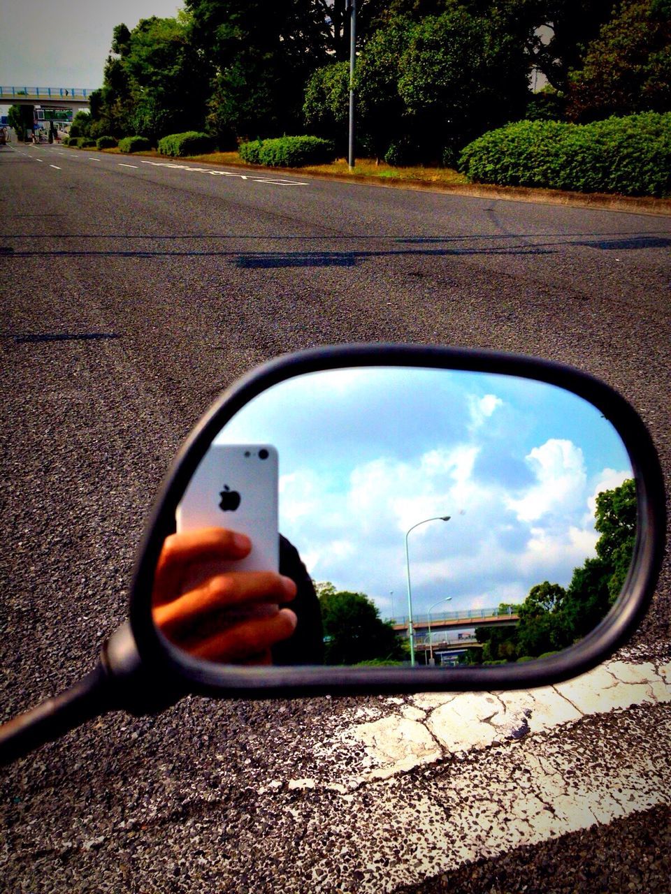 transportation, car, street, road, land vehicle, mode of transport, sky, tree, cloud - sky, side-view mirror, reflection, cloud, day, road marking, outdoors, asphalt, circle, no people, the way forward, sunlight