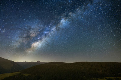 Low angle view of mountain against sky at night