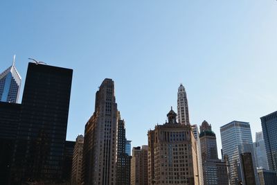 Low angle view of modern building against blue sky