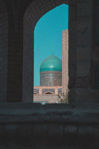 Open window of historic building against sky