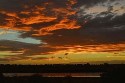 Scenic view of dramatic sky during sunset