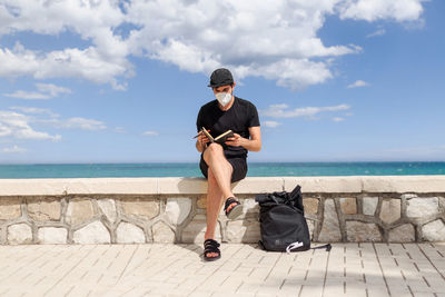 Full length of woman on sea against sky