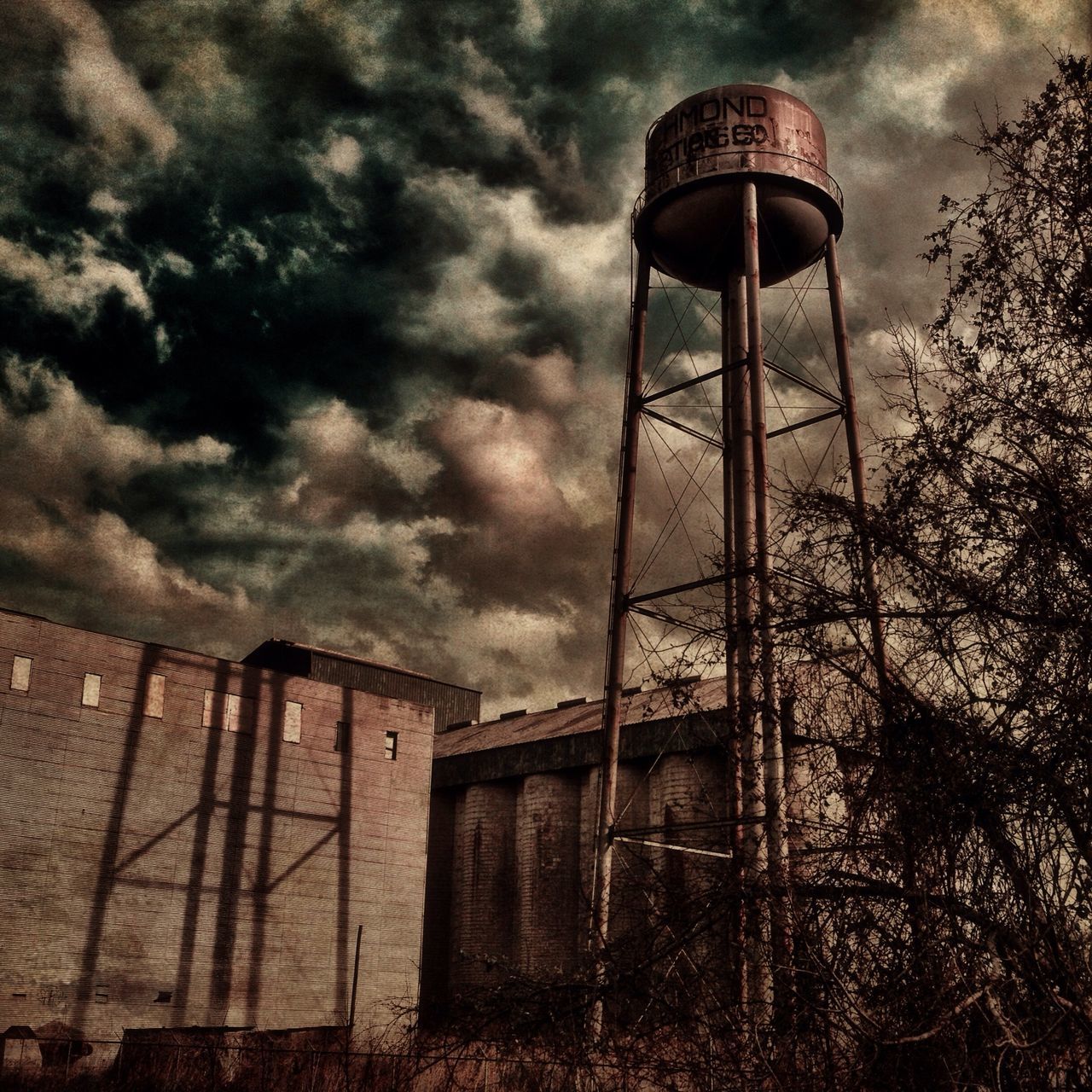 sky, architecture, built structure, cloud - sky, building exterior, cloudy, low angle view, cloud, house, protection, safety, weather, security, outdoors, lighting equipment, overcast, no people, day, street light, fence