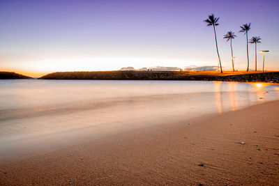 Scenic view of sea against sky at sunset