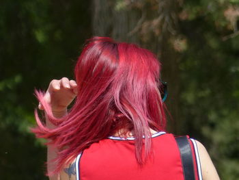 Rear view of woman with red dyed hair