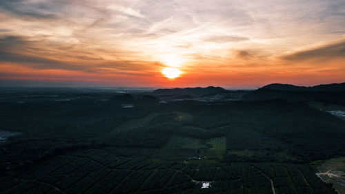 Scenic view of landscape against sky during sunset