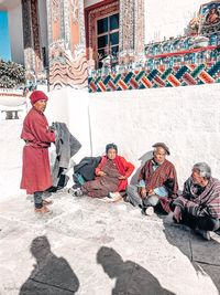 Group of people sitting outdoors