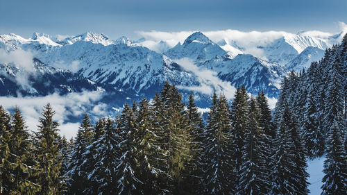 Snow covered mountains against sky