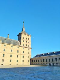 Low angle view of building against blue sky