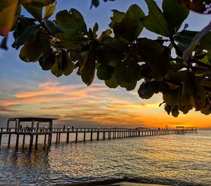 Scenic view of sea against orange sky